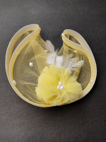 Yellow feather fascinator