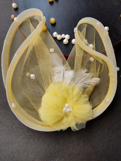 Yellow feather fascinator