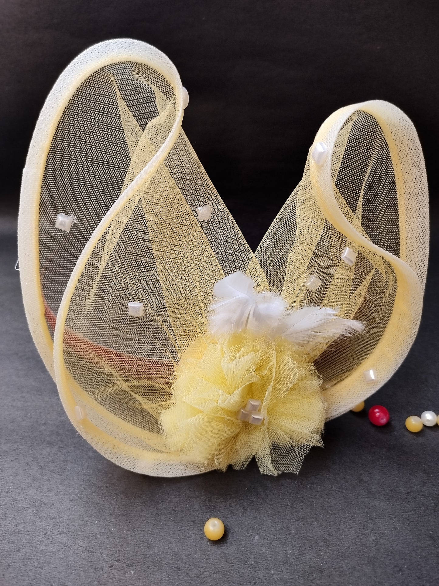 Yellow feather fascinator